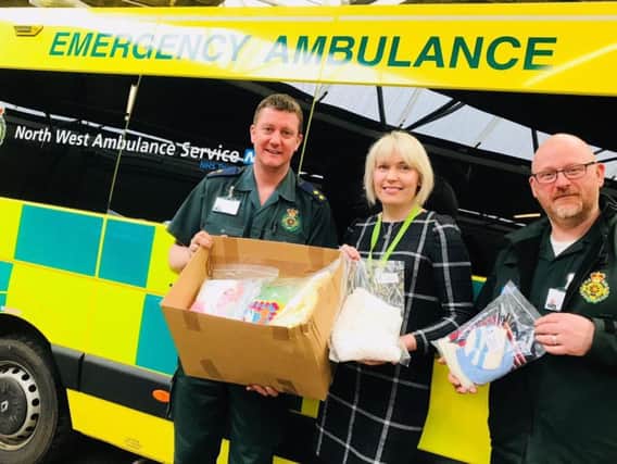 Dominic Gething, Senior Paramedic, and University of Cumbria student (left), Susan Rhind and Dave Warrington, Senior Paramedic, with the new hat kits