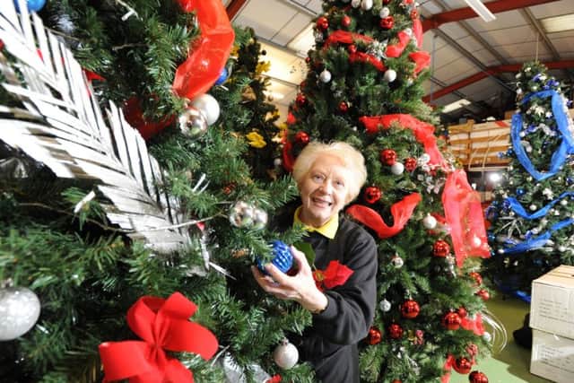 Margaret in her shop at Christmas time