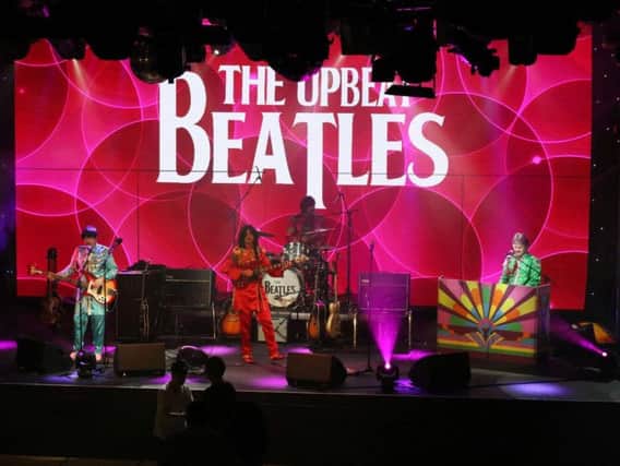 The Upbeat Beatles on stage