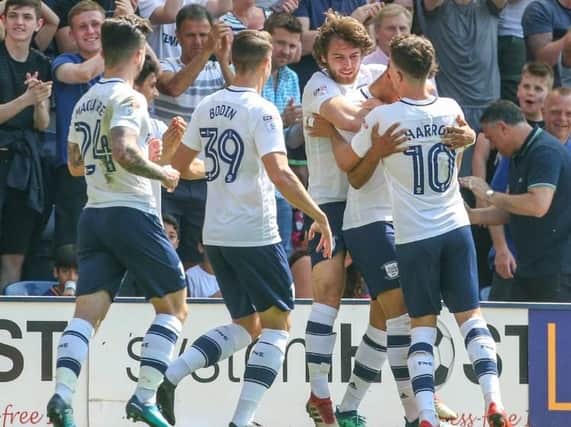 Callum Robinson is congratulated after giving PNE the lead