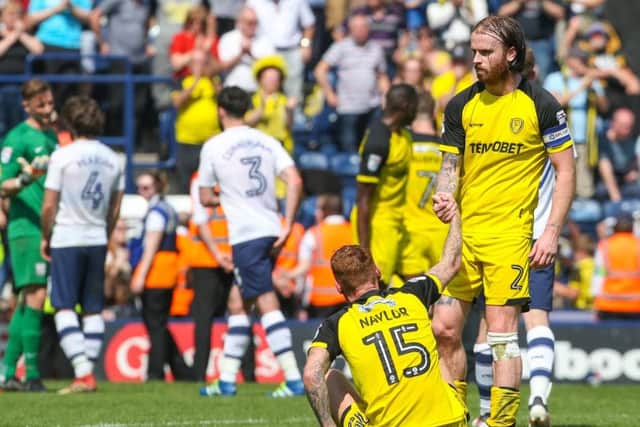 Burton captain John Brayford consoles Tom Naylor after the Brewers' relegation was confirmed