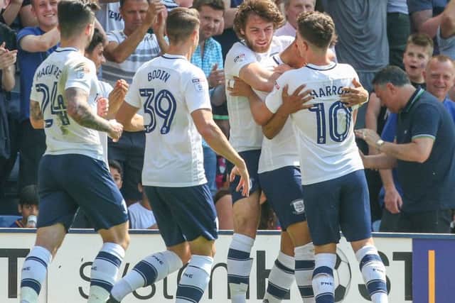 Callum Robinson is mobbed after his goal