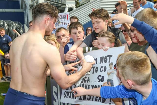 Browne hands a shirt to a fan after PNE ended their season with a 2-1 win over Burton