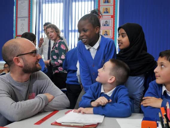 Author and screenwriter Tom Bidwell passes on tips to pupils at Frenchwood Community Primary School to help improve their story writing.