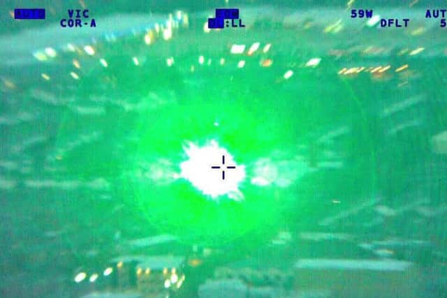 The crew were subjected to persistent green laser attack.