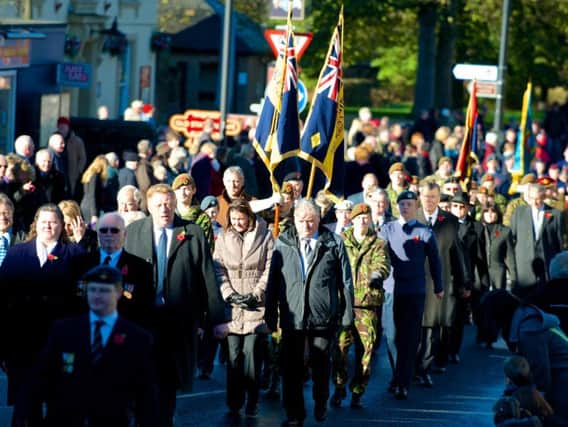 2013: The town gathers for the annual remembrance day parade, Led by the Longridge Band through the town, Father David Chinnery takes a short service and wreath laying at the War Memorial, the parade then goes to St Paul's Church for main service. Photo by Anthony Farran.