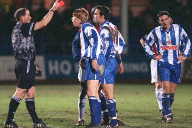 Hartlepool players protest after Gustavo Di Lella is sent-off against PNE