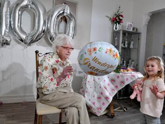 Phyllis Wallbank celebrating her 100th birthday with great grandaughter Nevaeh Kelly, three