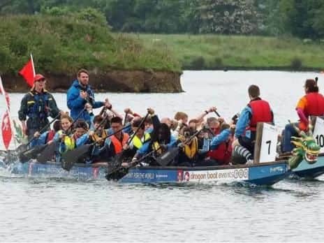 Competitors battle in the Dragon Boat Race
