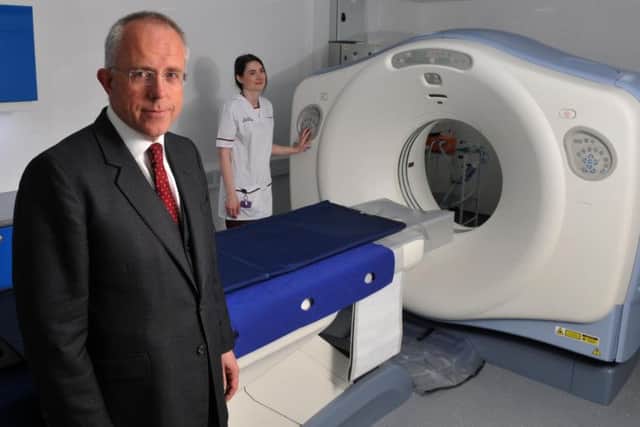 Coroner Dr James Adeley with the Digital autopsy machine at Royal Preston Hospital.