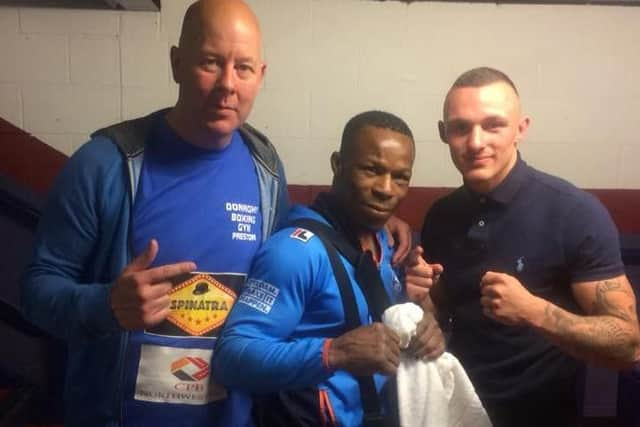 Reece MacMillan, right, with trainer John Donaghy and opponent Innocent Anyanwu