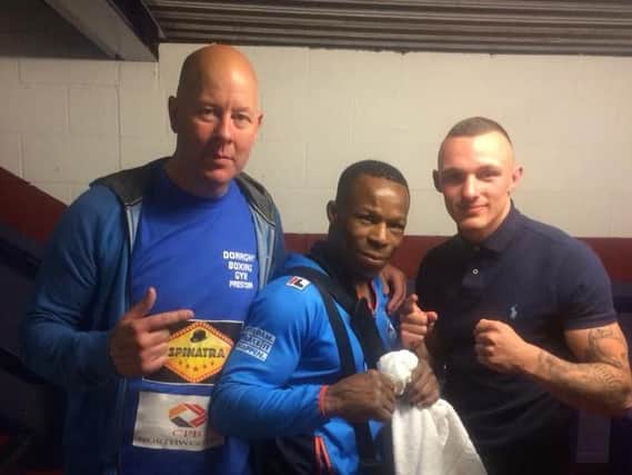 Reece MacMillan, right, with trainer John Donaghy and opponent Innocent Anyanwu