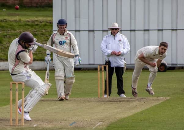 Garstang's Ian Walling bowls a hostile delivery on his way to match figures of 5-31. (Photo: Tim Gilbert/Preston Photographic Society)
