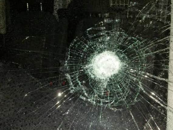A window on a police van was smashed by vandals in Preston while officers attended reports of a sudden death, say police.