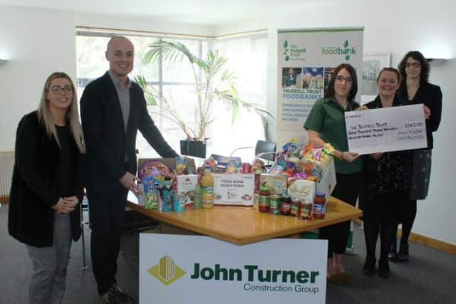 Staff from John Turner Construction with Trussell Trust representatives