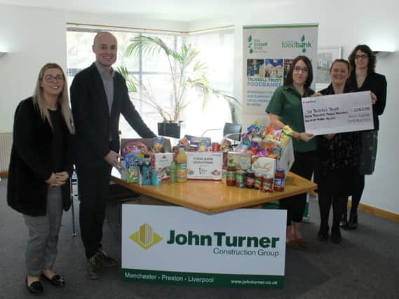 Staff from John Turner Construction with Trussell Trust representatives