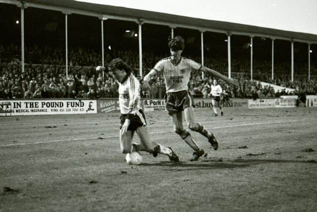 PNE midfielder John Kelly is tripped in the box