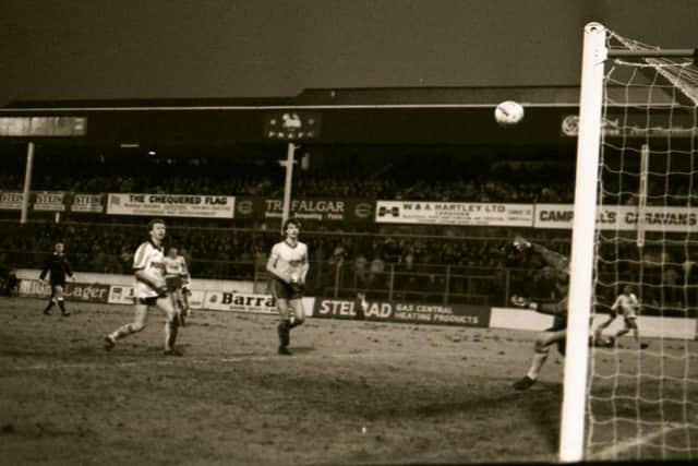 Alex Bruce goes for goal for PNE against Wigan