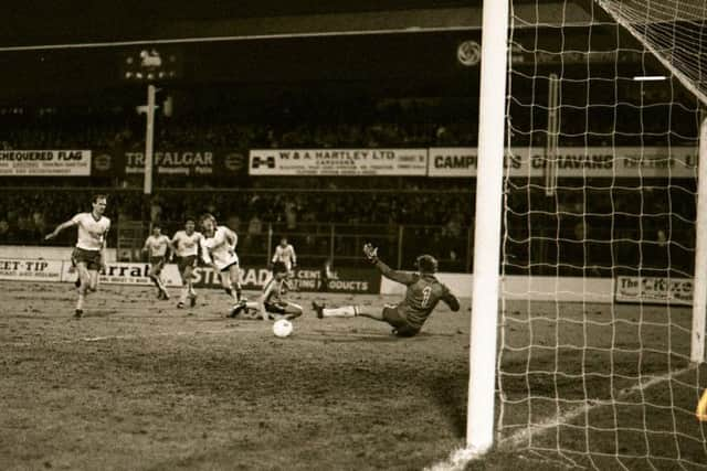 Graham Houston plays the ball across the box for PNE