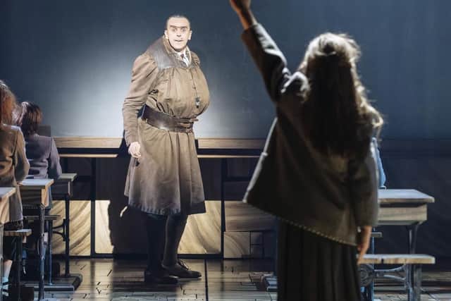 Craige Els on stage as Miss Trunchbull in Matilda - The Musical