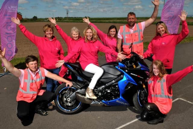 Riverview Motorcycle Training, Hesketh Bank, has gone pink in all their riding gear to raise awareness for breast cancer screening, with Debbie Dowie from Boot out Breast Cancer with supporters and staff. Photos and video by Neil Cross.