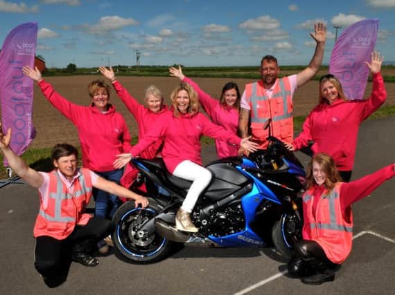 Riverview Motorcycle Training, Hesketh Bank, has gone pink in all their riding gear to raise awareness for breast cancer screening, with Debbie Dowie from Boot out Breast Cancer with supporters and staff. Photos and video by Neil Cross.