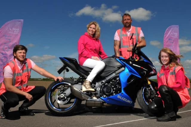 Riverview Motorcycle Training, Hesketh Bank, has gone pink in all their riding gear to raise awareness for breast cancer screening, with Debbie Dowie from Boot out Breast Cancer, Russ Roberts and Wayne Taylor and  actress Jessica Jayne Harney