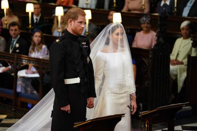 Prince Harry and Meghan Markle in St George's Chapel at Windsor Castle for their wedding. PRESS ASSOCIATION