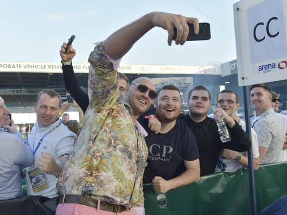 Tyson Fury poses for pictures with fans at the Josh Warrington-Lee Selby fight in Leeds at the weekend