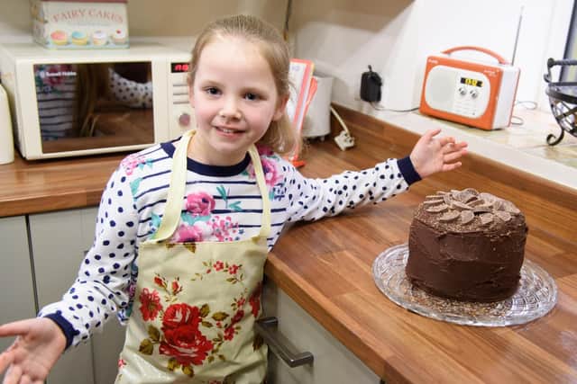 Grace Smith with one of her cakes