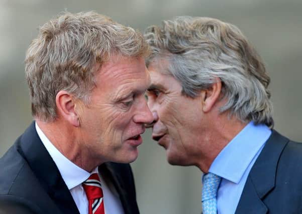 Pellegrini with Moyes (left) who he is replacing at the Hammers