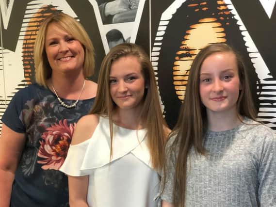 Annette McNeil and daughters Caitlin (centre) and Erin (right) were at the Manchester Arena during the attack last year.