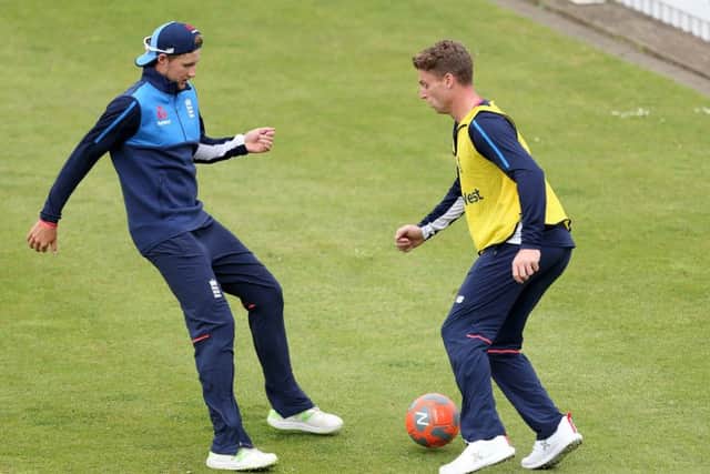 Jos Buttler and England captain Joe Root during a game of football in England training ahead of the first test of the summer