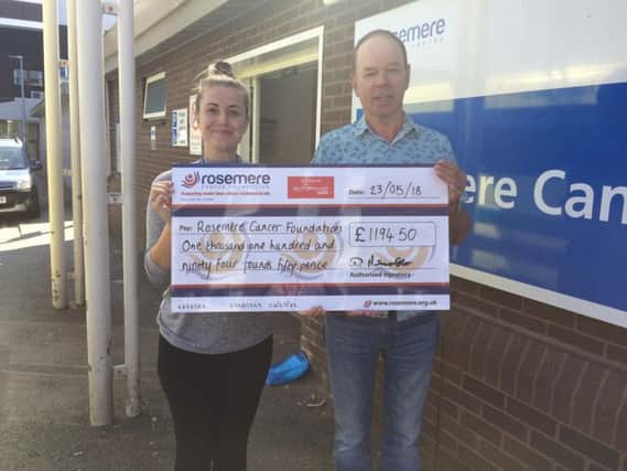 Denis Ashcroft presents a cheque to Rebecca Hall, area fund-raising co-ordinator at Rosemere Cancer Foundation