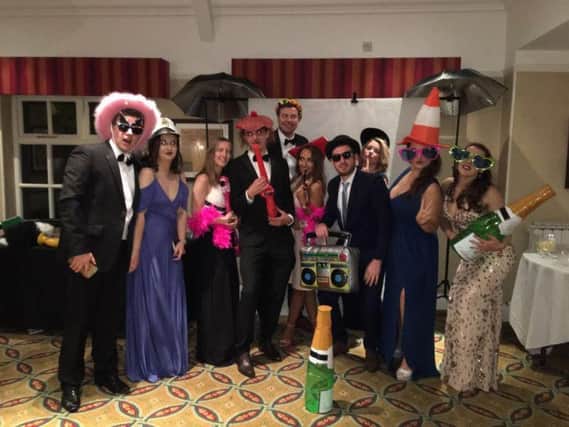 Guests wear hats for Headway's sapphire ball
