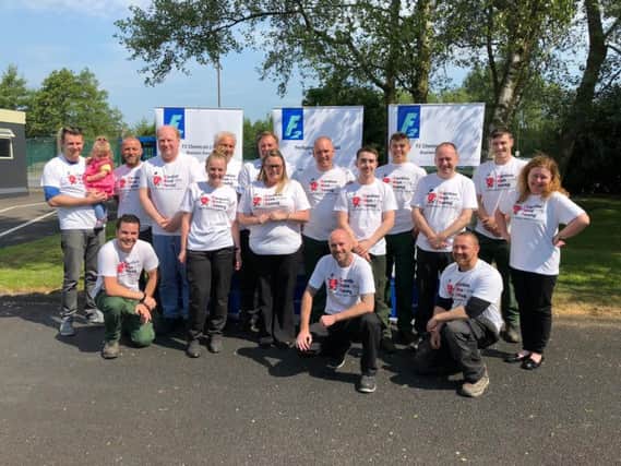 Rob Bamber (front row, middle) with his colleagues from F2 Chemicals Ltd who are doing the Dragon Boat Challenge for CRY in memory of Stevie Wiggins