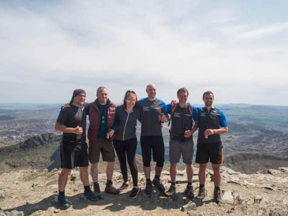 Jason Wadsworth, Rob Howard, Emma Howard, Alex Wadsworth, William Magowan and Anton Tsarev at the summit of Mount Snowdon