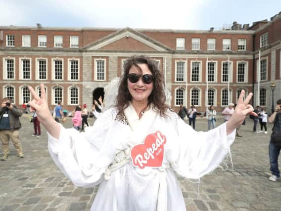 A Yes campaigner outside Dublin Castle. Photo: Niall Carson/PA
