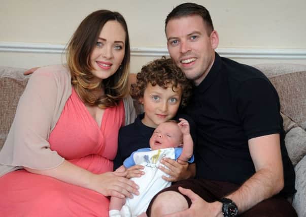 Richard Howarth, of Shakespeare Terrace in Chorley, who had to become the emergency midwife for wife Danielle when she went into labour a week early.
Richard with Danielle, son Joshua (7) and baby Samuel.  PIC BY ROB LOCK
23-5-2018