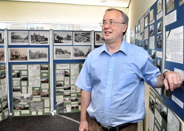 Picture by Julian Brown 26/05/18
Chairman Peter Houghton puts some finishing touches to the exhibition
Leyland Heritage Centre temporary exhibition to commemorate Leyland Historical Societyâ¬"s 50th Anniversary