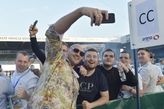 Tyson Fury takes photos with fans at the Josh Warrington-Lee Selby fight in Leeds earlier this month