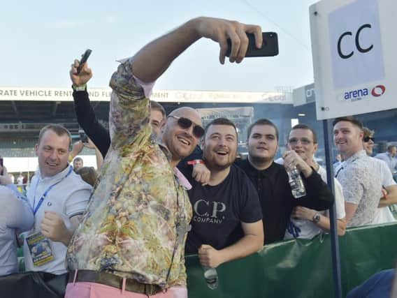 Tyson Fury takes photos with fans at the Josh Warrington-Lee Selby fight in Leeds earlier this month