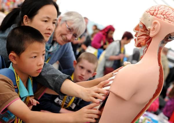 Annual Lancashire Science Festival at UCLAN, Preston. Mac Zhang aged 8 from Preston puts together a human body model from the School of Medicine. Picture by Paul Heyes, Saturday July 01, 2017.