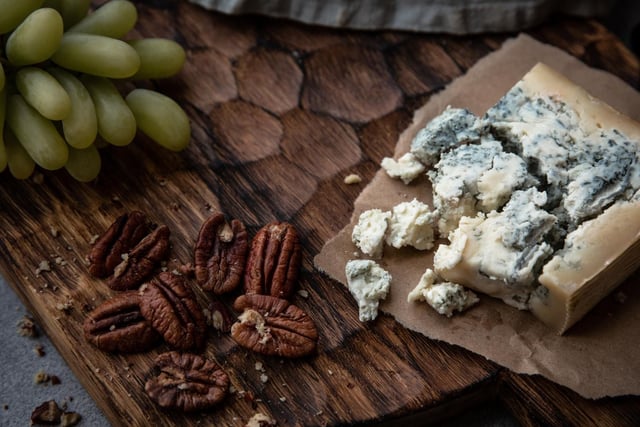 A blue cheese like roquefort contains fungus harboring a substance called roquefortine C. In extreme cases, dogs can develop muscle tremors and seizures which can last up to two days.